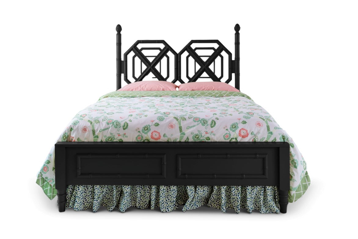 A black faux bamboo bed with chinoiserie bedding from madcap cottage