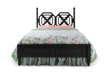 A black faux bamboo bed with chinoiserie bedding from madcap cottage