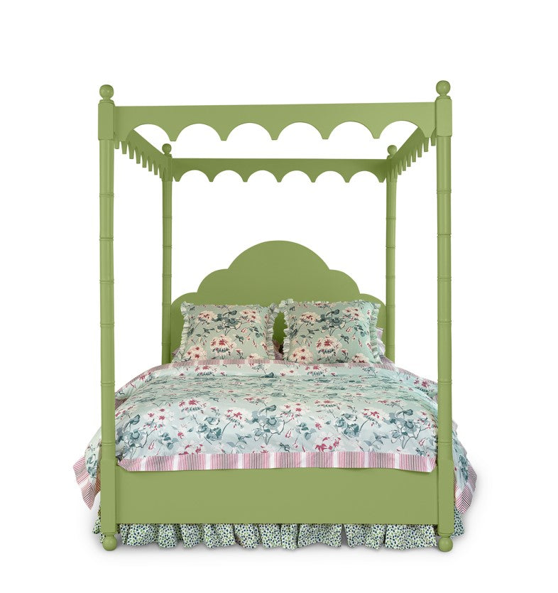 A green four poster canopy bed