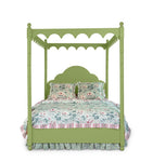 A green four poster canopy bed