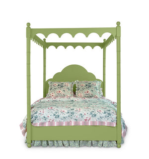 A green four poster canopy bed