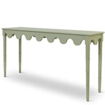 A custom green console table with scalloped edges