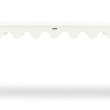 A white console table with scalloped edges