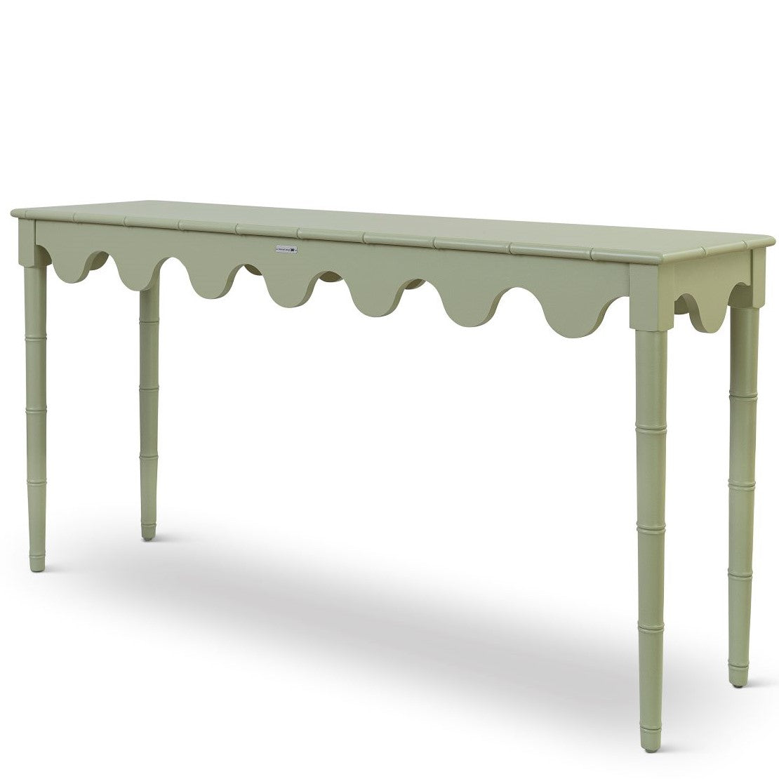 A custom green console table with scalloped edges