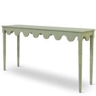 A custom green console table with scalloped edges