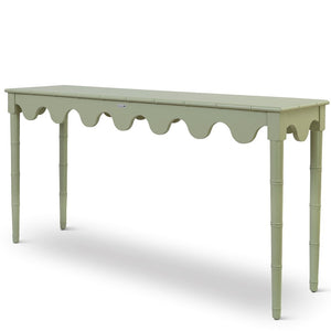 A custom green console table with scalloped edges
