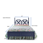A green faux bamboo bed with chinoiserie bedding from madcap cottage and arrows depicting dimensions of a queen size bed