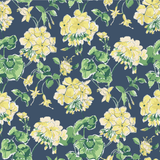 madcap Cottage geranium fabric featuring yellow geraniums with green leaves on a navy blue background. 