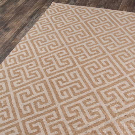 A beige and brown geometric pattern area rug.