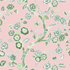 A chinoiserie fabric in pink featuring green cherry blossom motifs.