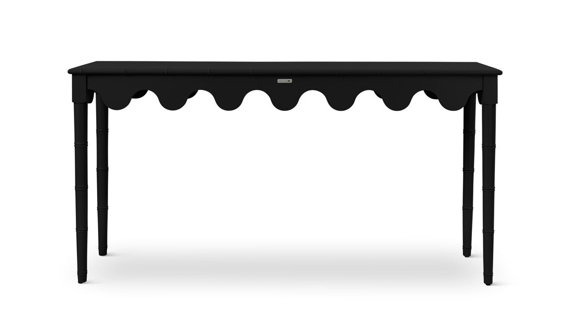 A black console table with scalloped edges