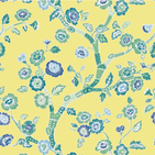 A green, blue and white chinoiserie fabric featuring blue cherry blossom motifs on a yellow background. 