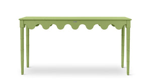 A green console table with scalloped edges