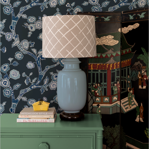 green chest and blue lamp against Blue and white chinoiserie wallpaper