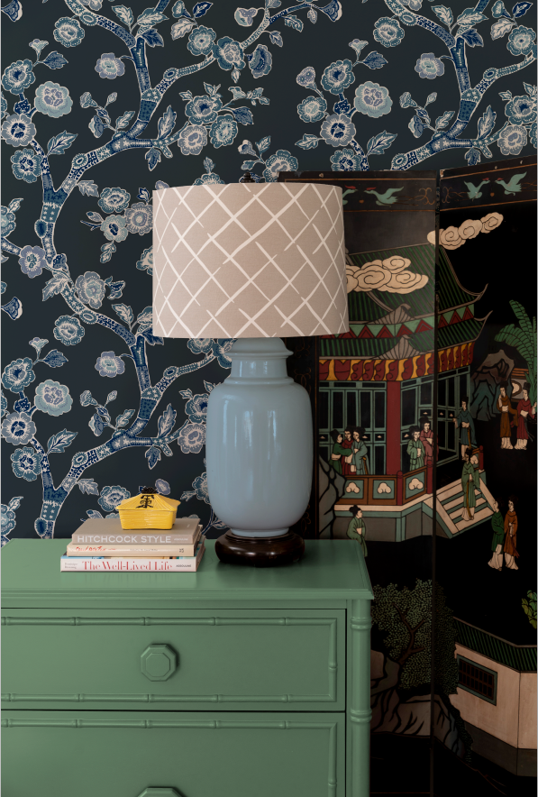 green chest and blue lamp against Blue and white chinoiserie wallpaper