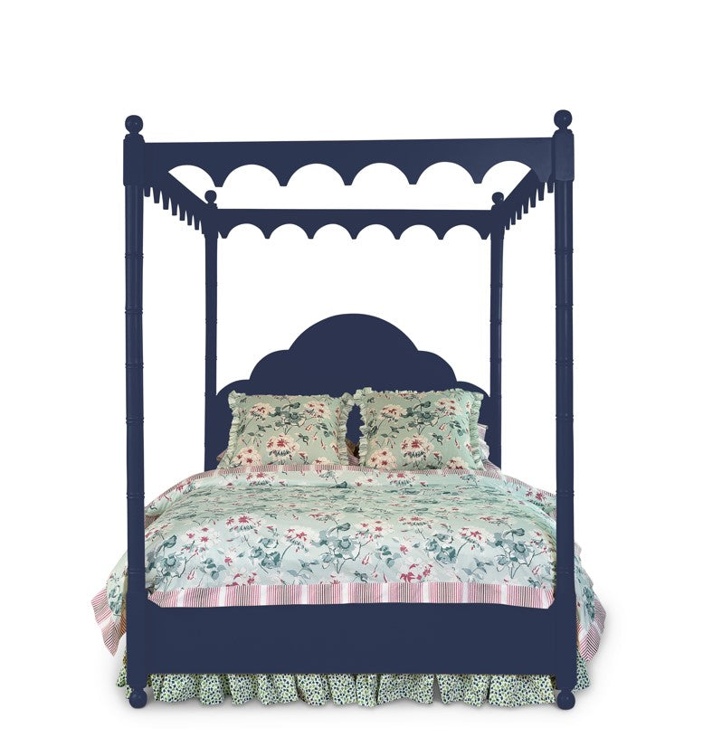 a four poster navy blue canopy bed with floral bedding 