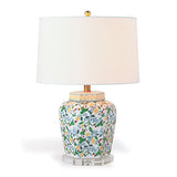 A strawberry lampbase with a repeating  strawberry, lemon and leaf motif pattern and white lampshade