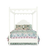 a four poster white canopy bed