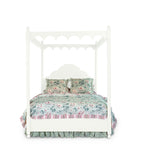 a four poster white canopy bed