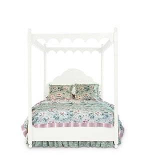 a four poster white canopy bed
