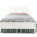 A white faux bamboo bed with chinoiserie bedding from madcap cottage