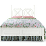 A white faux bamboo bed with chinoiserie bedding from madcap cottage