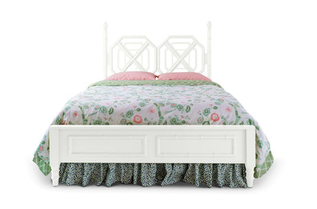 A white faux bamboo bed with chinoiserie bedding from madcap cottage