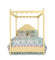 a four poster yellow canopy bed with floral bedding