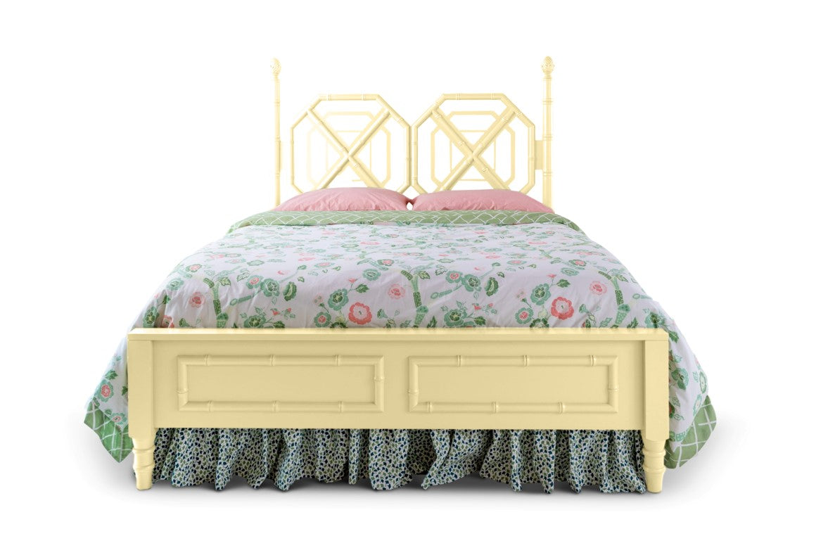 A yellow faux bamboo bed with chinoiserie bedding from madcap cottage